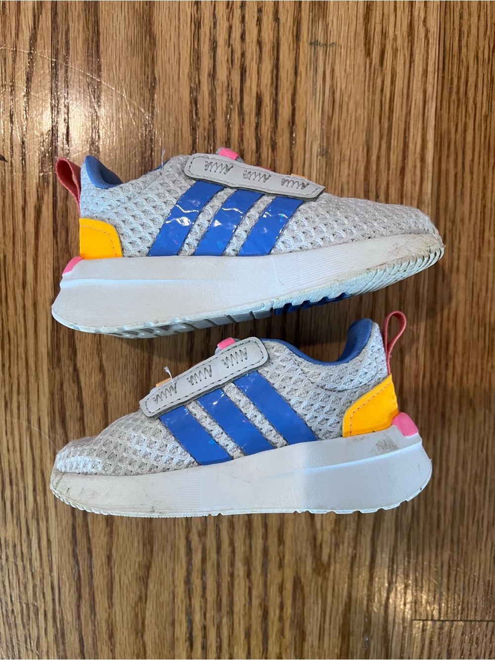 adidas Kids White Mesh Sneakers with Blue Stripes and Yellow & Pink Accents